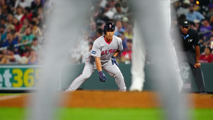 Jul 23, 2024; Denver, Colorado, USA; Boston Red Sox outfielder Masataka Yoshida (7) leans off base in the seventh inning against the Colorado Rockies at Coors Field. Mandatory Credit: Ron Chenoy-USA TODAY Sports