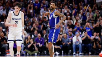 Mar 18, 2024; Sacramento, California, USA; Sacramento Kings guard Malik Monk (0) celebrates after scoring a basket during overtime against the Memphis Grizzlies at Golden 1 Center. Mandatory Credit: Sergio Estrada-USA TODAY Sports