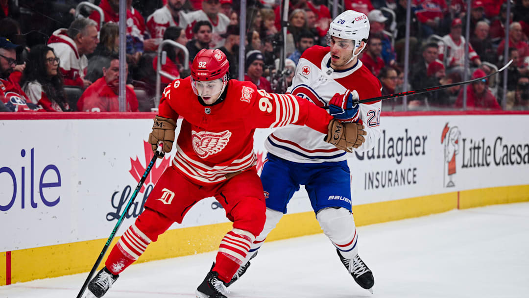 Mar 19, 2026; Detroit, Michigan, USA; Detroit Red Wings center Marco Kasper (92) and Montreal Canadiens left wing Juraj Slafkovsky (20) battle for the puck during the second period at Little Caesars Arena. Mandatory Credit: Tim Fuller-Imagn Images