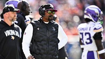 Oct 15, 2023; Chicago, Illinois, USA;  Minnesota Vikings defensive coordinator Brian Flores watches his team play against the Chicago Bears  at Soldier Field. Mandatory Credit: Jamie Sabau-Imagn Images