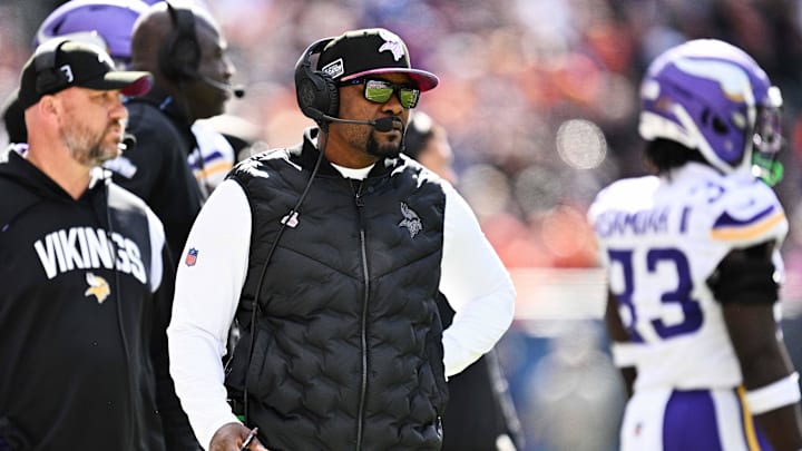 Oct 15, 2023; Chicago, Illinois, USA;  Minnesota Vikings defensive coordinator Brian Flores watches his team play against the Chicago Bears  at Soldier Field. Mandatory Credit: Jamie Sabau-Imagn Images