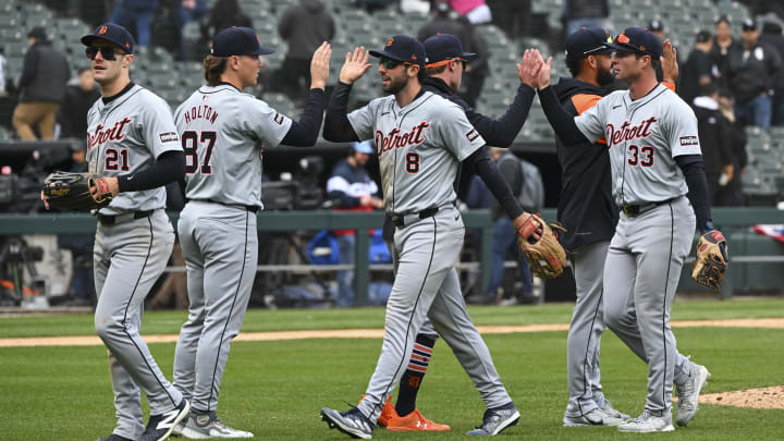 Detroit Tigers line up for high fives in their win against the Chicago White Sox.