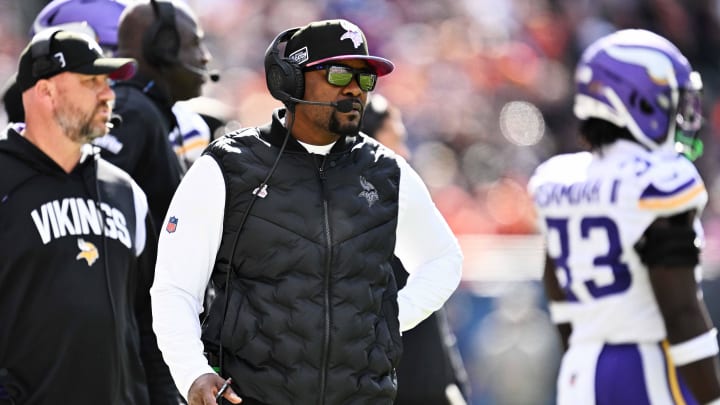 Minnesota Vikings defensive coordinator Brian Flores watches his team play against the Chicago Bears  at Soldier Field.