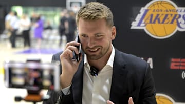 Aug 2, 2025; El Segundo, CA, USA; Los Angeles Lakers Luka Doncic (77) is interviewed by ESPN LA radio following a press conference announcing the signing of a 3-year, $165 million contract extension at UCLA Health Training Center. Mandatory Credit: Jayne Kamin-Oncea-Imagn Images