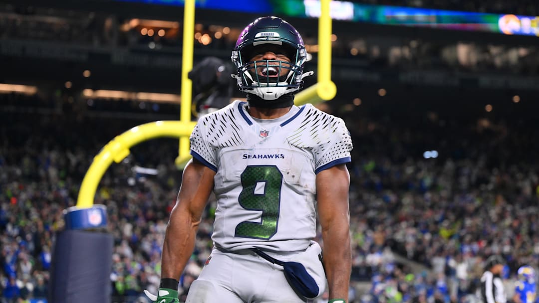 Dec 18, 2025; Seattle, Washington, USA; Seattle Seahawks running back Kenneth Walker III (9) celebrates after scoring a touchdown against the Los Angeles Rams in the second half at Lumen Field. Mandatory Credit: Steven Bisig-Imagn Images