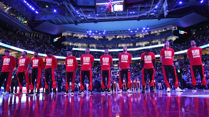 Toronto Raptors players stand during the national anthems prior to the start of game against the Cleveland Cavaliers at Scotiabank Arena. 