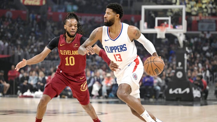 Apr 7, 2024; Los Angeles, California, USA; Cleveland Cavaliers guard Darius Garland (10) defends Los Angeles Clippers forward Paul George (13) in the first half at Crypto.com Arena. Mandatory Credit: Jayne Kamin-Oncea-USA TODAY Sports