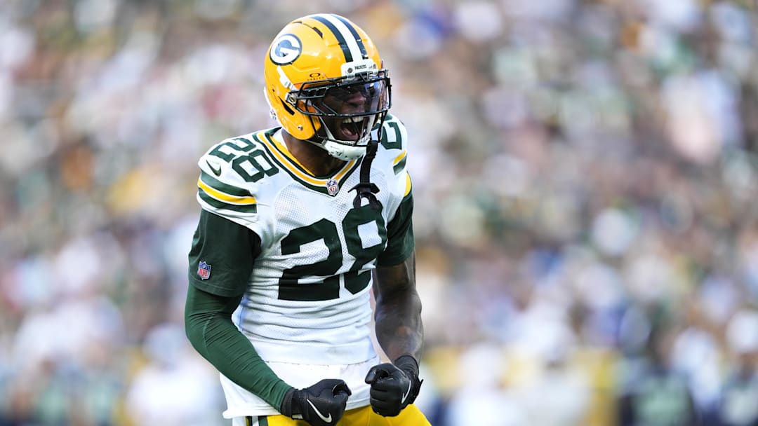 Aug 23, 2025; Green Bay, Wisconsin, USA; Green Bay Packers linebacker Isaiah Simmons (28) reacts to tackling Seattle Seahawks running back Jacardia Wright (31) during the second half at Lambeau Field. Mandatory Credit: Kayla Wolf-Imagn Images