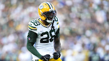 Aug 23, 2025; Green Bay, Wisconsin, USA; Green Bay Packers linebacker Isaiah Simmons (28) reacts to tackling Seattle Seahawks running back Jacardia Wright (31) during the second half at Lambeau Field. Mandatory Credit: Kayla Wolf-Imagn Images