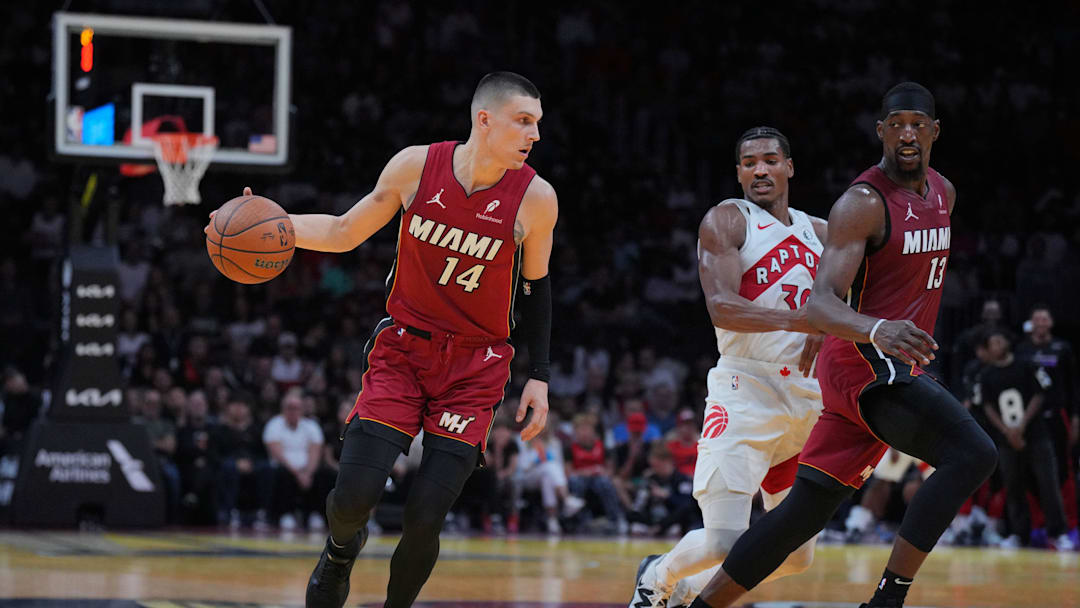 Nov 29, 2024; Miami, Florida, USA;  Miami Heat guard Tyler Herro (14) brings the ball up the court against the Toronto Raptors during the second half in an NBA Cup game at Kaseya Center. Mandatory Credit: Jim Rassol-Imagn Images