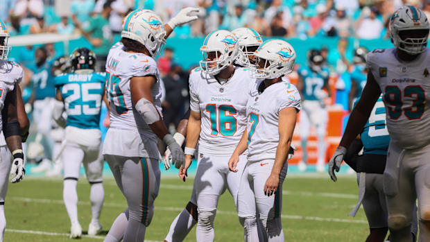 Miami Dolphins place kicker Jason Sanders (7) celebrates with punter Jake Bailey (16)