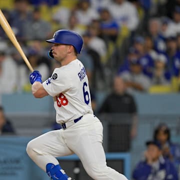 Los Angeles, California, USA; Los Angeles Dodgers catcher Dalton Rushing (68) singles against the Athletics during the third inning of the game at Dodger Stadium.