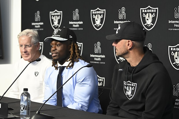 Raiders coach Pete Carroll, Ashton Jeanty and general manager John Spytek during a news conference introducing Jeanty.