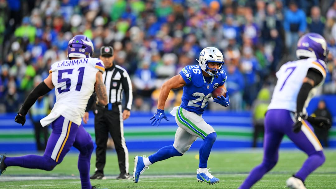 Nov 30, 2025; Seattle, Washington, USA; Seattle Seahawks running back Zach Charbonnet (26) runs the ball after a catch during the second half against the Minnesota Vikings at Lumen Field. Mandatory Credit: Steven Bisig-Imagn Images