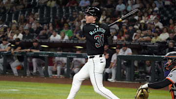 Jun 3, 2024; Phoenix, Arizona, USA; Arizona Diamondbacks outfielder Jake McCarthy (31) hits a double against the San Francisco Giants in the ninth inning at Chase Field. Mandatory Credit: Rick Scuteri-USA TODAY Sports