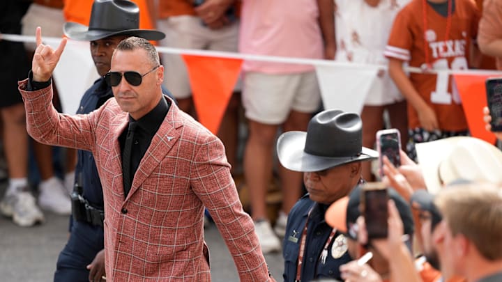 Texas Longhorns head coach Steve Sarkisian holds up his horns while entering Darrell K Royal-Texas Memorial Stadium. Texas Longhorns head coach Steve Sarkisian holds up his horns while entering Darrell K Royal-Texas Memorial Stadium.