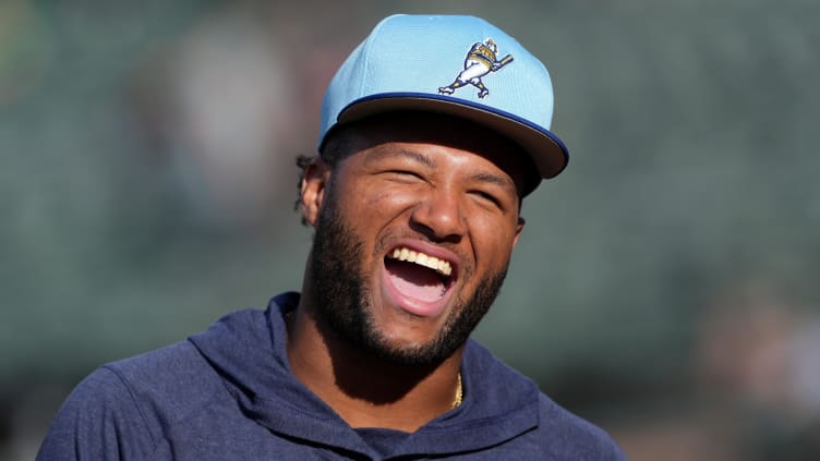 Aug 23, 2024; Oakland, California, USA; Milwaukee Brewers left fielder Jackson Chourio (11) laughs before the game against the Oakland Athletics at Oakland-Alameda County Coliseum. Mandatory Credit: Darren Yamashita-USA TODAY Sports