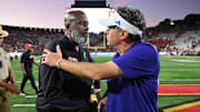 Maryland coach Mike Locksley and Washingtoncoach Jedd Fisch shake hands following Washington's shocking comeback win on Saturday, October 4.