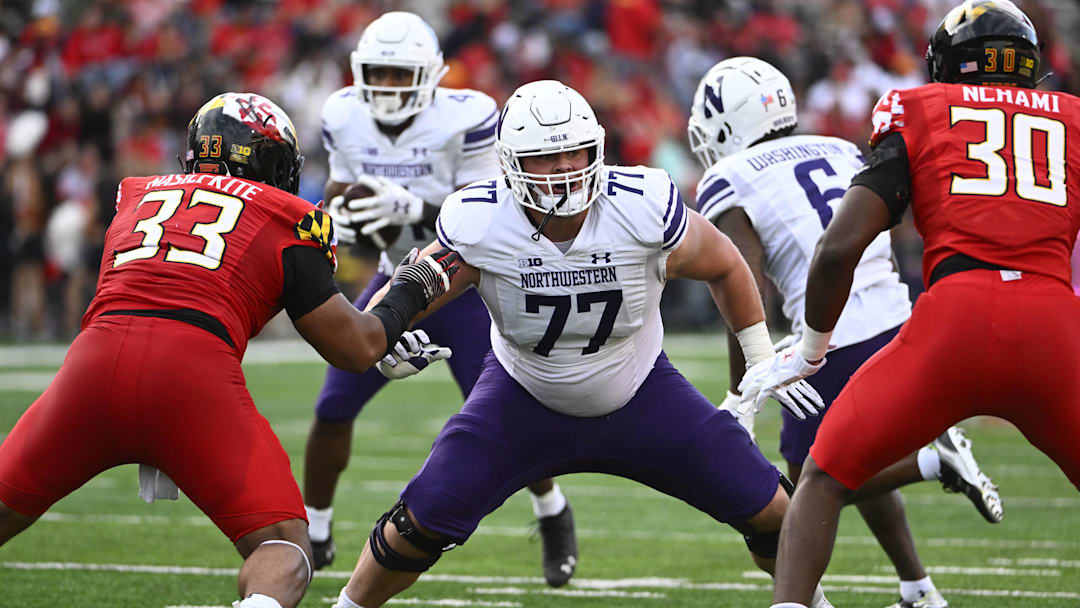 Oct 22, 2022; College Park, Maryland, USA; Northwestern Wildcats offensive lineman Peter Skoronski (77) prepares to block against the Maryland Terrapins at SECU Stadium. Mandatory Credit: Brad Mills-Imagn Images Oct 22, 2022; College Park, Maryland, USA; Northwestern Wildcats offensive lineman Peter Skoronski (77) prepares to block against the Maryland Terrapins at SECU Stadium. Mandatory Credit: Brad Mills-Imagn Images