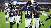 Aug 7, 2025; Baltimore, Maryland, USA; Baltimore Ravens linebacker Jay Higgins IV (49) celebrates after an interception against the Indianapolis Colts during the fourth quarter at M&T Bank Stadium. Mandatory Credit: Rafael Suanes-Imagn Images