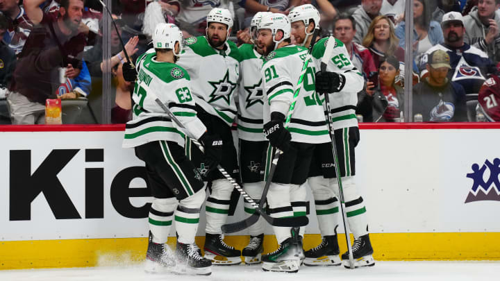 May 17, 2024; Denver, Colorado, USA; Dallas Stars left wing Jamie Benn (14) celebrates his goal scored with center Tyler Seguin (91) and defenseman Thomas Harley (55) and right wing Evgenii Dadonov (63) and defenseman Miro Heiskanen (4)  in the third period against the Colorado Avalanche in game six of the second round of the 2024 Stanley Cup Playoffs at Ball Arena. Mandatory Credit: Ron Chenoy-USA TODAY Sports