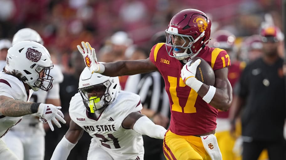 USC wide receiver Prince Strachan carries the ball against Missouri State linebacker Jashawn Cooper.