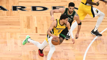 May 23, 2024; Boston, Massachusetts, USA; Indiana Pacers guard Tyrese Haliburton (0) dribbles the ball against Boston Celtics forward Jayson Tatum (0) in the first half during game two of the eastern conference finals for the 2024 NBA playoffs at TD Garden. Mandatory Credit: Brian Fluharty-USA TODAY Sports