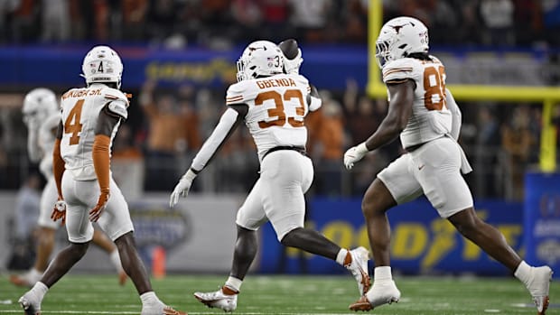 Jan 10, 2025; Arlington, Texas, USA; Texas Longhorns linebacker David Gbenda (33) celebrates with defensive back Andrew Mukub