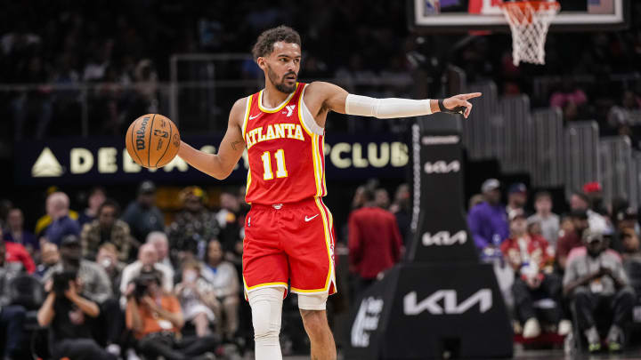 Apr 10, 2024; Atlanta, Georgia, USA; Atlanta Hawks guard Trae Young (11) points to a teammate against the Charlotte Hornets during the first half at State Farm Arena. Mandatory Credit: Dale Zanine-USA TODAY Sports