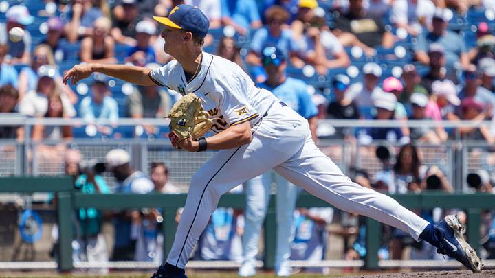 Jun 17, 2026; Omaha, NE, USA; West Virginia Mountaineers starting pitcher Chansen Cole (35) throws the opening pitch against the North Carolina Tar Heels at Charles Schwab Field. Mandatory Credit: Dylan Widger-Imagn Images