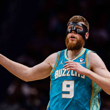 Apr 7, 2024; Charlotte, North Carolina, USA; Charlotte Hornets forward Davis Bertans (9) runs back against the Oklahoma City Thunder at Spectrum Center. Mandatory Credit: Scott Kinser-Imagn Images