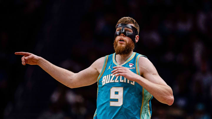 Apr 7, 2024; Charlotte, North Carolina, USA; Charlotte Hornets forward Davis Bertans (9) runs back against the Oklahoma City Thunder at Spectrum Center. Mandatory Credit: Scott Kinser-Imagn Images