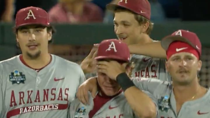 Arkansas players console left fielder Charles Davalan after the heartbreaking loss. Arkansas players console left fielder Charles Davalan after the heartbreaking loss.