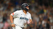 Sep 13, 2025; Seattle, Washington, USA; Seattle Mariners first baseman Josh Naylor (12) runs towards first base after hitting a 2-RBI single against the Los Angeles Angels during the fifth inning at T-Mobile Park. Mandatory Credit: Steven Bisig-Imagn Images