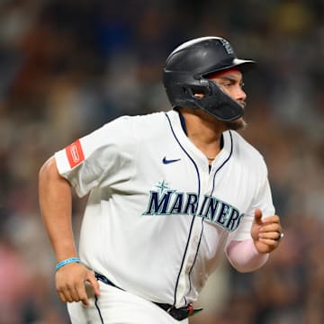 Sep 13, 2025; Seattle, Washington, USA; Seattle Mariners first baseman Josh Naylor (12) runs towards first base after hitting a 2-RBI single against the Los Angeles Angels during the fifth inning at T-Mobile Park. Mandatory Credit: Steven Bisig-Imagn Images