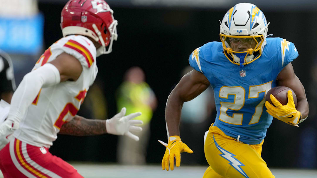 Los Angeles Chargers running back J.K. Dobbins (27) carries the ball in the first quarter against the Kansas City Chiefs at SoFi Stadium.