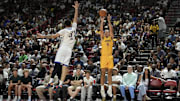 Jul 10, 2025; Las Vegas, NV, USA; Los Angeles Lakers forward Cole Swider (41) shoots a three point basket  against Dallas Mavericks forward Jordan Hall (37) in the fourth quarter of their game at Thomas & Mack Center. Mandatory Credit: Candice Ward-Imagn Images