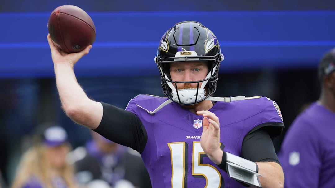 Oct 12, 2025; Baltimore, Maryland, USA; Baltimore Ravens quarterback Cooper Rush (15) warms up prior to the game against the Los Angeles Rams at M&T Bank Stadium. Mandatory Credit: Mitch Stringer-Imagn Images
