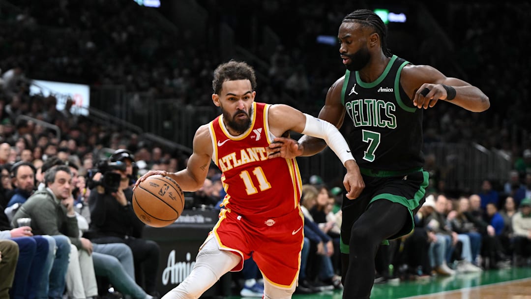Jan 18, 2025; Boston, Massachusetts., USA; Atlanta Hawks guard Trae Young (11) drives to the basket against Boston Celtics guard Jaylen Brown (7) during the second quarter at the TD Garden. Mandatory Credit: Brian Fluharty-Imagn Images