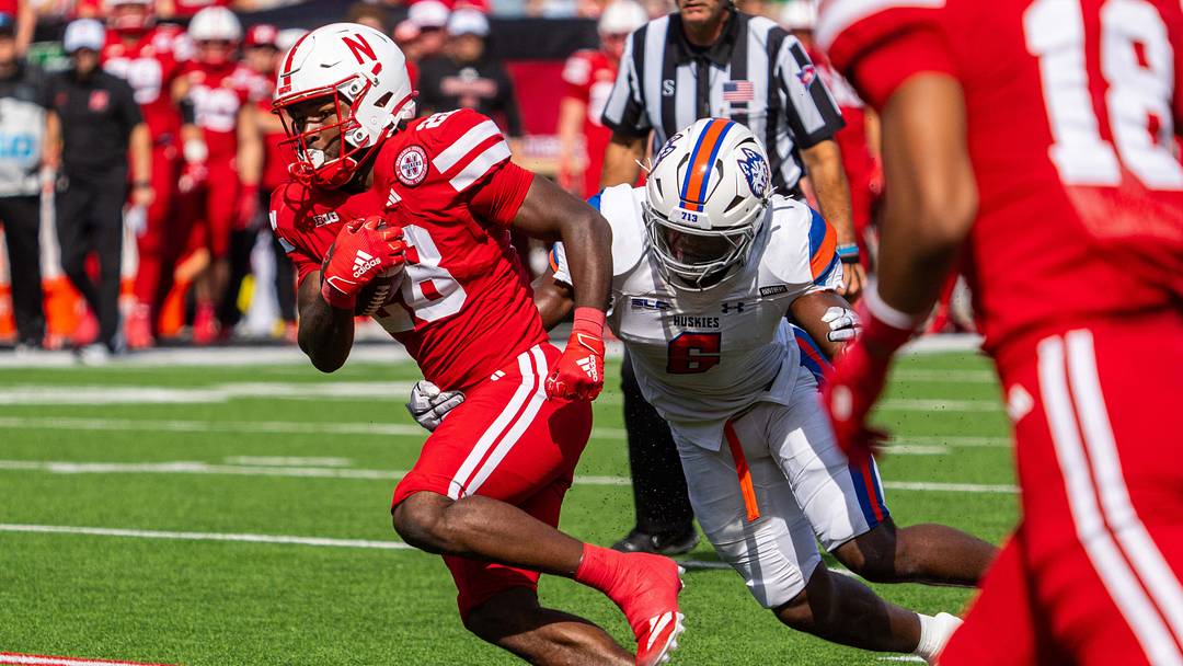 Nebraska running back Kwinten Ives breaks the line of scrimmage against Houston Christian at Memorial Stadium in 2025.