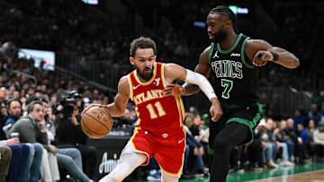 Jan 18, 2025; Boston, Massachusetts., USA; Atlanta Hawks guard Trae Young (11) drives to the basket against Boston Celtics guard Jaylen Brown (7) during the second quarter at the TD Garden. Mandatory Credit: Brian Fluharty-Imagn Images