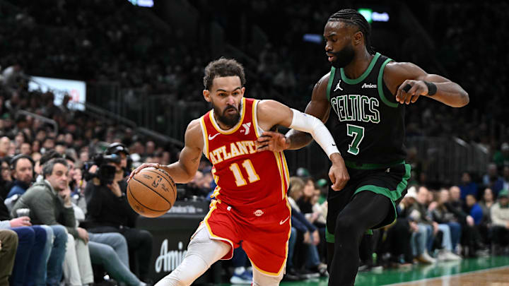 Jan 18, 2025; Boston, Massachusetts., USA; Atlanta Hawks guard Trae Young (11) drives to the basket against Boston Celtics guard Jaylen Brown (7) during the second quarter at the TD Garden. Mandatory Credit: Brian Fluharty-Imagn Images