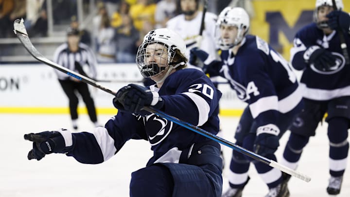 Mar 7, 2025; Ann Arbor, MI, USA;  Penn State forward JJ Wiebusch (20) celebrates his game winning goal in overtime against the michigan wolverines during a Big Ten Tournament quarter final game at Yost Arena. Mandatory Credit: Rick Osentoski-Imagn Images