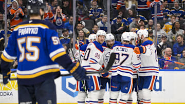 Feb 4, 2025; St. Louis, Missouri, USA;  Edmonton Oilers center Leon Draisaitl (29) is congratulated by teammates after scoring the game tying goal against the St. Louis Blues during the third period at Enterprise Center. Mandatory Credit: Jeff Curry-Imagn Images