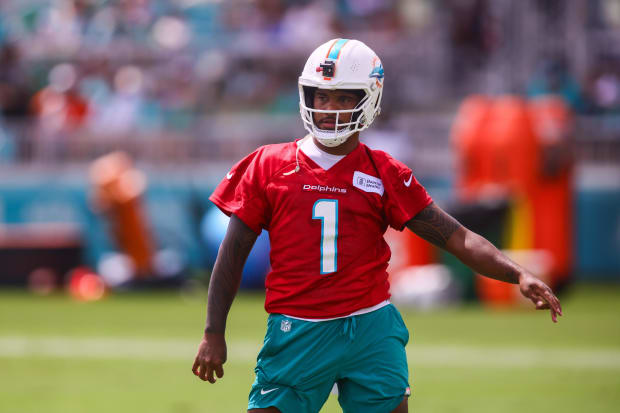 Tua Tagovailoa stands during a Dolphins practice.