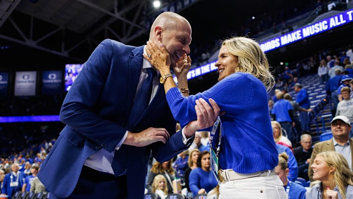 Nov 9, 2024; Lexington, Kentucky, USA; Kentucky Wildcats head coach Mark Pope hugs his wife Lee Anne after the game against the Bucknell Bison at Rupp Arena at Central Bank Center. Mandatory Credit: Jordan Prather-Imagn Images