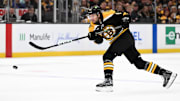 Nov 3, 2024; Boston, Massachusetts, USA; Boston Bruins defenseman Andrew Peeke (52) takes a shot against the Seattle Kraken during the first period at the TD Garden. Mandatory Credit: Brian Fluharty-Imagn Images