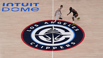May 1, 2025; Inglewood, California, USA; A general overall view as LA Clippers guard James Harden (1) dribbles the ball against Denver Nuggets guard Christian Braun (0) at micourt on the Clippers logo in the first half during game six of first round for the 2025 NBA Playoffs at Intuit Dome. Mandatory Credit: Kirby Lee-Imagn Images