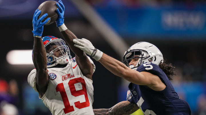 Dec 30, 2023; Atlanta, GA, USA; Mississippi Rebels wide receiver Dayton Wade (19) catches a pass behind Penn State Nittany Lions cornerback Cam Miller (5) during the first half at Mercedes-Benz Stadium. Mandatory Credit: Dale Zanine-USA TODAY Sports