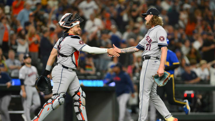 Jul 19, 2024; Seattle, Washington, USA; Houston Astros catcher Yainer Diaz (21) and relief pitcher Josh Hader (71) celebrate defeating the Seattle Mariners at T-Mobile Park.